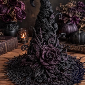 May include: A dark purple and black crocheted witch hat featuring an intricate leaf and vine pattern throughout the cone. A large, detailed crocheted rose sits at the base, accented with small purple beads and a wide, scalloped lace brim.