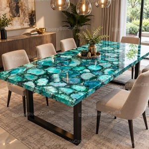May include: A rectangular dining table featuring a polished surface made of inlaid teal and green agate slices with a glossy epoxy finish. The table is supported by a sturdy black metal frame and is surrounded by six beige upholstered chairs.