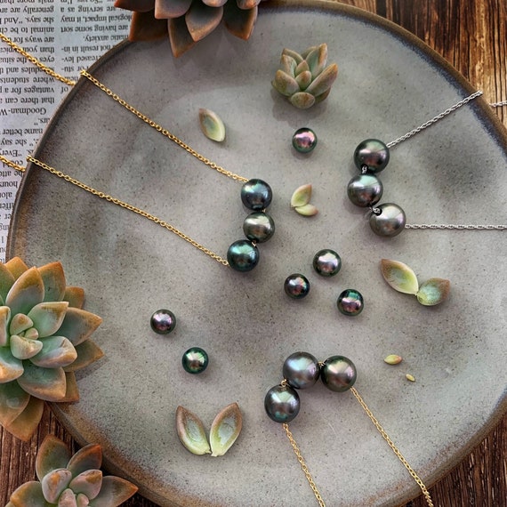 Sliding pearl necklace deals