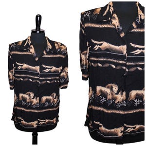 May include: A black button-up shirt with a short sleeve and a brown and white print of running lions and other animals.