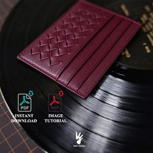 May include: A deep burgundy leather card holder featuring a woven texture on one side and three vertical card slots. The item is displayed with digital icons labeled PDF INSTANT DOWNLOAD and PDF IMAGE TUTORIAL, along with the Sobi Studio logo.