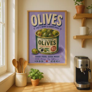 May include: A rectangular wall art print with a light purple background featuring a central illustration of a green can filled with green olives. The text reads OLIVES, SALTY, BRINY & ALWAYS RIGHT, EXTRA VIRGIN OLIVES, PITTED & PERFECT, GOOD STUFF, GOOD FOOD, GOOD MOOD, little things, big difference.