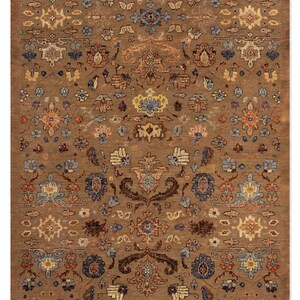 May include: A rectangular area rug featuring a brown base color with an intricate, repeating floral and botanical pattern in shades of blue, orange, yellow, and cream. The design consists of symmetrical motifs and stylized blossoms across the surface.