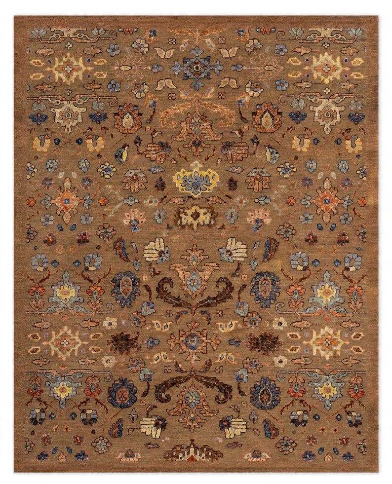 May include: A rectangular area rug featuring a brown base color with an intricate, repeating floral and botanical pattern in shades of blue, orange, yellow, and cream. The design consists of symmetrical motifs and stylized blossoms across the surface.
