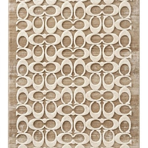 May include: A rectangular area rug featuring a repeating cream-colored C-shaped logo pattern set against a textured tan background. The design consists of interlocking letter motifs arranged in a grid, creating a high-contrast visual effect.