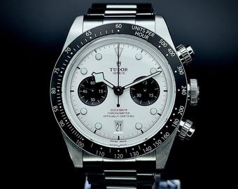 Reloj de hombre Tudor automático cronógrafo con esfera blanca e indicador de fecha.