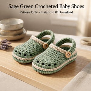 May include: A pair of sage green crocheted baby shoes with a beige trim and a small wooden button on the side strap. The text Sage Green Crocheted Baby Shoes Pattern Only Instant PDF Download is visible at the top of the image.