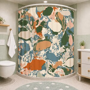 May include: A shower curtain featuring an abstract pattern of organic, rounded shapes in shades of forest green, burnt orange, muted blue, cream, and soft pink. The design consists of overlapping, fluid color blocks that create a marbled effect.