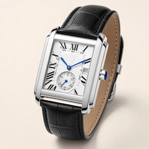 May include: A rectangular wristwatch with a silver-tone case and a black leather strap featuring a crocodile-embossed texture. The white dial displays black Roman numerals, blue hands, a small seconds sub-dial, and a date window at the three o'clock position.