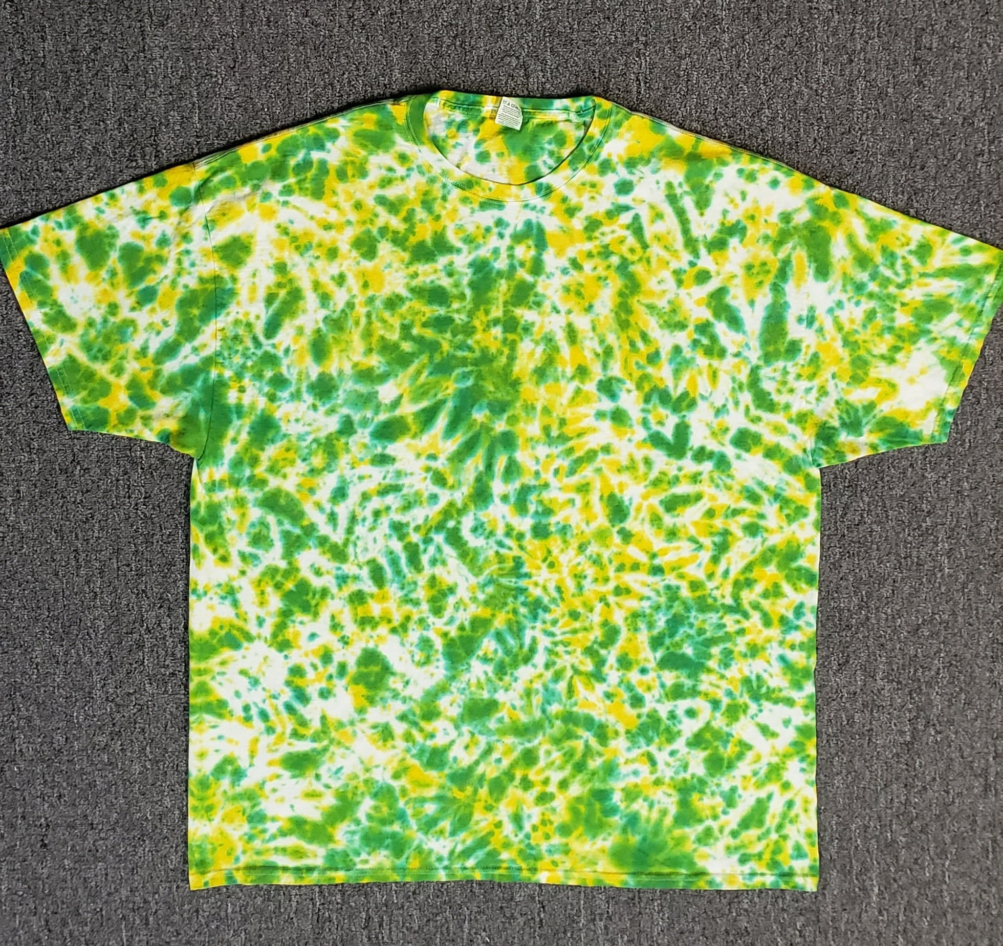 white and yellow tie dye shirt