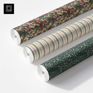 May include: Three rolls of wrapping paper. The top roll features a pattern of birds, pine branches, pinecones, and red berries. The middle roll has vertical stripes in green, cream, and red. The bottom roll displays a dark green botanical print.