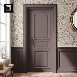 May include: A brown door with a white and beige floral wallpaper. The door has a brass door handle and a raised panel design.