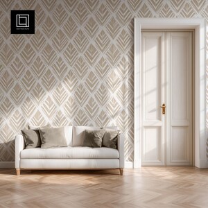 May include: A modern living room scene featuring a white sofa with several neutral-toned pillows. The wall is adorned with a beige and white leaf pattern wallpaper. A closed, white double door and a wooden floor complete the interior design.