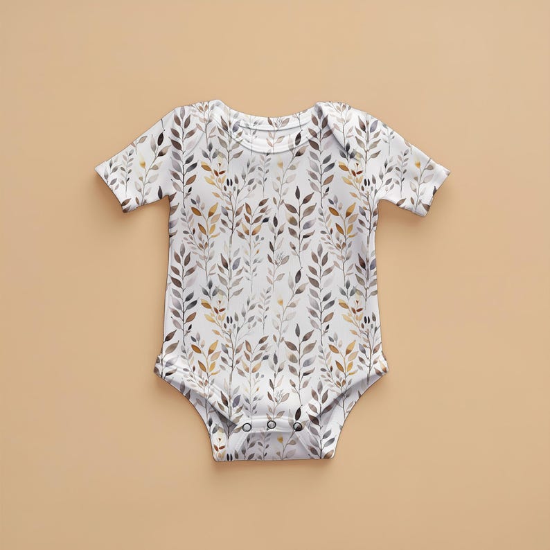 May include: A white baby onesie with a watercolor pattern of brown, gray, and yellow leaves.