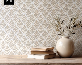 May include: A still-life composition featuring a wooden table with books and a beige ceramic vase holding olive branches. The background is a wallpaper with a repeating leaf pattern in beige and white. The logo "1001 Mockups" is in the top left corner.