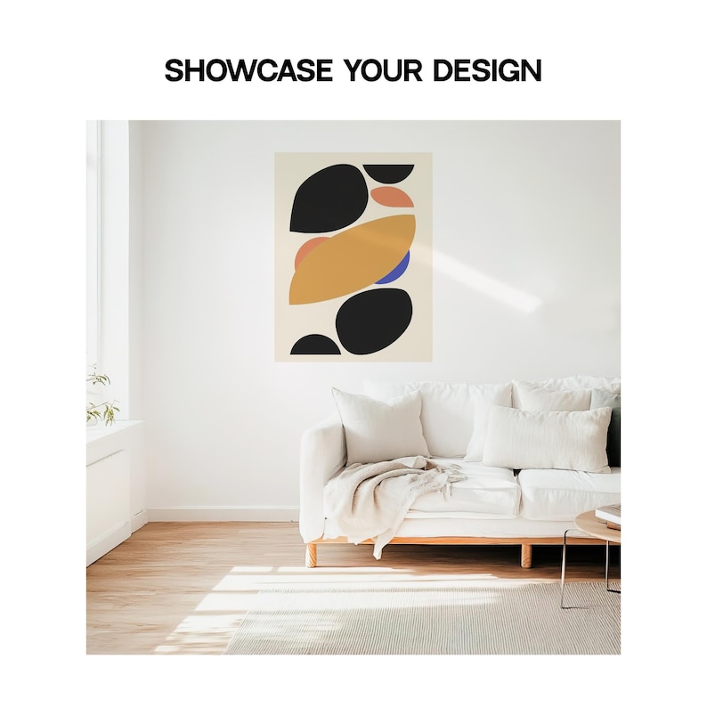 May include: Abstract art print with black, yellow, orange, and blue shapes on a cream background. The print is hanging on a white wall above a white couch with a throw blanket.