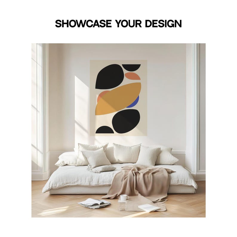 May include: A beige linen sofa with a brown throw blanket and three white pillows. A framed abstract print with black, yellow, blue, and orange shapes hangs on the wall behind the sofa.