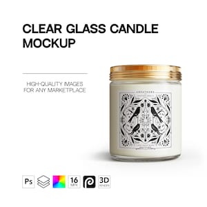 May include: A clear glass candle with a gold lid and a white label featuring a black and white design of birds and floral patterns. The label text reads "AREATHORS SHATME GEALE CANS SEATY BURD".