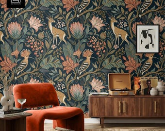 May include: A room featuring a dark blue floral wallpaper with deer and bird illustrations. An orange chair and wooden cabinet with a record player are in the foreground. A framed abstract art piece hangs on the wall.