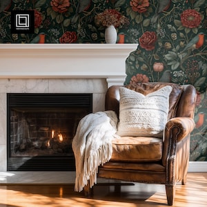 May include: A living room with a leather armchair, fringed throw, and decorative pillow. The room features a fireplace with a white mantel and floral wallpaper with red flowers and birds. The scene evokes a sense of comfort and is ideal for home decor.
