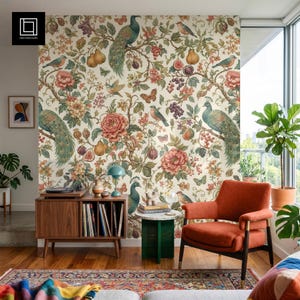May include: A room featuring a floral wallpaper with peacocks, birds, and fruit. A mid-century modern record player and an orange armchair are in the foreground. A small green side table and a colorful rug complete the scene.