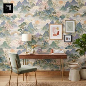 May include: A home office scene with a wooden desk, a green velvet chair, and framed art. The wallpaper depicts an Asian landscape with mountains, bridges, and pagodas in pastel shades. A lamp, books, and a potted plant add to the decor. The desk is 120 cm long.