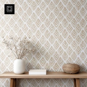 May include: A light-toned interior scene with a wooden table displaying a white vase with dried flowers, a white box, and a woven basket. The background is a wallpaper with a repeating diamond pattern in beige and white.