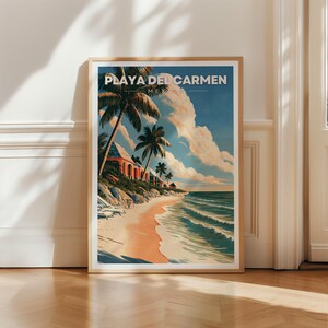 May include: A framed vertical art print featuring a beach scene in Playa del Carmen, Mexico. The illustration depicts palm trees, a sandy beach, turquoise ocean waves, and buildings under a blue sky with clouds. The text reads Playa del Carmen Mexico.