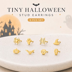 May include: A set of eight gold-toned stud earrings featuring Halloween-themed shapes including a spider, ghost, spiderweb, witch hat, pumpkin, bat, skull, and coffin. The text TINY HALLOWEEN STUD EARRINGS 8 PCS SET is displayed above the jewelry.