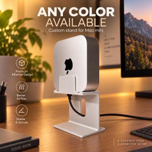 May include: A silver-colored metal stand designed for a Mac mini, featuring a vertical orientation with a central cutout for cable management. The text reads ANY COLOR AVAILABLE, Custom stand for Mac mini, Premium Minimal Design, Better Airflow, Stable & Secure, A CLEANER DESK, A BRIGHTER SETUP.