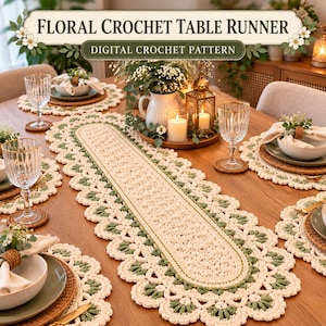 Puede incluir: Un patrón de ganchillo digital para un camino de mesa floral con un diseño ovalado alargado en hilo color crema y detalles en verde salvia. El intrincado borde tipo encaje presenta motivos florales festoneados.