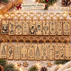 May include: A collection of twenty rectangular wooden keychains featuring black laser-engraved Christmas designs, including snowmen, reindeer, trees, and holiday text. Each keychain is attached to a gold-toned metal ring.