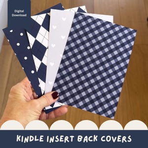 May include: A set of rectangular Kindle insert back covers featuring various patterns including navy blue with white polka dots, a navy and white argyle print, a light gray sheet with white hearts, and a navy and white gingham check pattern.