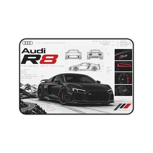 May include: A rectangular desk mat featuring a black Audi R8 sports car on a winding road. The design includes technical line drawings, the Audi logo, and text such as Audi R8, Performance Meets Precision, and V10 FSI. The color palette is black, white, and red.