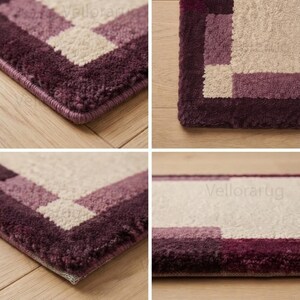May include: A rectangular rug featuring a geometric border pattern in shades of deep plum, light purple, and cream. The rug has a thick, tufted pile texture with a finished edge and the text Vellorarug visible on the surface of the fabric.