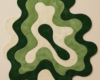 May include: An area rug featuring an irregular, organic shape with layered, wavy patterns in shades of dark forest green, sage green, and cream. The rug has a soft, tufted texture and a continuous, flowing design that creates a sense of depth.