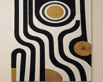 May include: A square area rug featuring a cream-colored background with bold, black, flowing lines. The design includes two prominent mustard-yellow circles, one with a dark gray ring, and a small reddish-brown center dot on the lower circle.