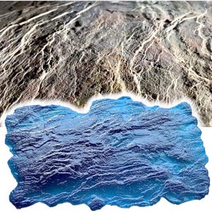 May include: A rectangular blue concrete stamp mat featuring a rugged, natural rock texture with deep ridges and uneven surfaces. The tool is designed to imprint a realistic stone pattern onto surfaces, showcasing a vibrant blue color and detailed relief.