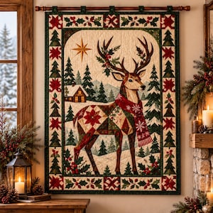 May include: A rectangular wall hanging quilt featuring a central deer with antlers adorned with holly, wearing a red scarf. The background shows a snowy forest with a cabin and a gold star. The border displays a pattern of pine trees and holly.