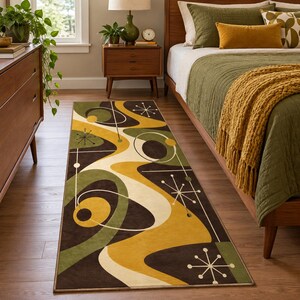 May include: A rectangular area rug featuring a mid-century modern pattern with abstract flowing shapes in shades of dark brown, olive green, and mustard yellow, accented by thin white lines and starburst motifs across the entire surface.