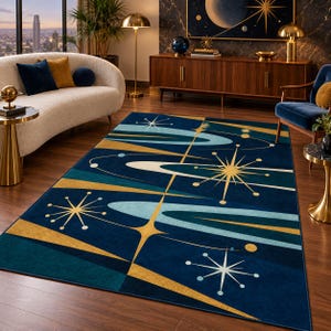 May include: A rectangular area rug featuring a deep blue background with a geometric pattern of gold and light blue starbursts, orbital rings, and abstract shapes. The design incorporates sharp lines and celestial motifs across the surface.