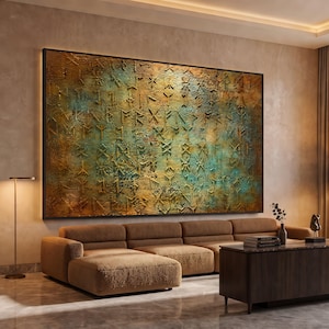 May include: A large rectangular wall art piece featuring a heavily textured surface with a mix of metallic gold, bronze, and oxidized teal green tones. The artwork is covered in embossed runic symbols and characters across the entire surface.