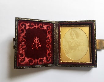 Antique Victorian Daguerreotype Ambrotype of a woman, leather portrait case with brass clasp