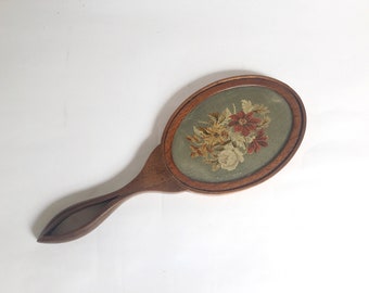 Antique Victorian wooden hand mirror with flower embroidered back