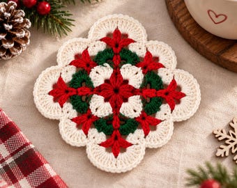 May include: A square crochet coaster featuring a central star pattern in red, surrounded by dark green and cream-colored yarn. The coaster has a scalloped edge design with a repeating floral motif, crafted with intricate stitching in a festive color palette.