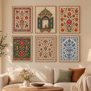 May include: A gallery wall arrangement of six rectangular framed prints featuring intricate floral patterns, paisley motifs, and a central architectural window illustration, displayed above a beige sofa with decorative throw pillows.