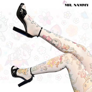 May include: White tights featuring a colourful, repeating pattern of various cartoon characters, animals, and shapes. The tights are paired with black high-heeled sandals with an ankle strap. The text MR. NAMMY is visible in the top right corner.