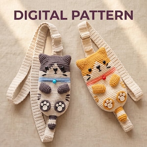 May include: Two crochet cat-shaped crossbody bags with adjustable straps. One bag is grey and white with a blue collar, and the other is orange and white with a pink collar. Both feature black button eyes, embroidered whiskers, and small paws. Text reads DIGITAL PATTERN.