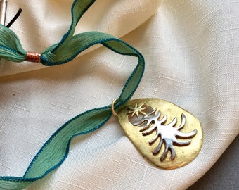 Ala Matisse Christmas Tree pendant in Brass and German Silver on Adjustable chenille ribbon