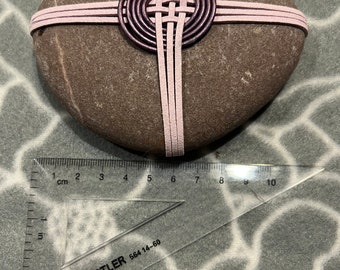 Zen Rock, wrapped in leather cord, pink and purple